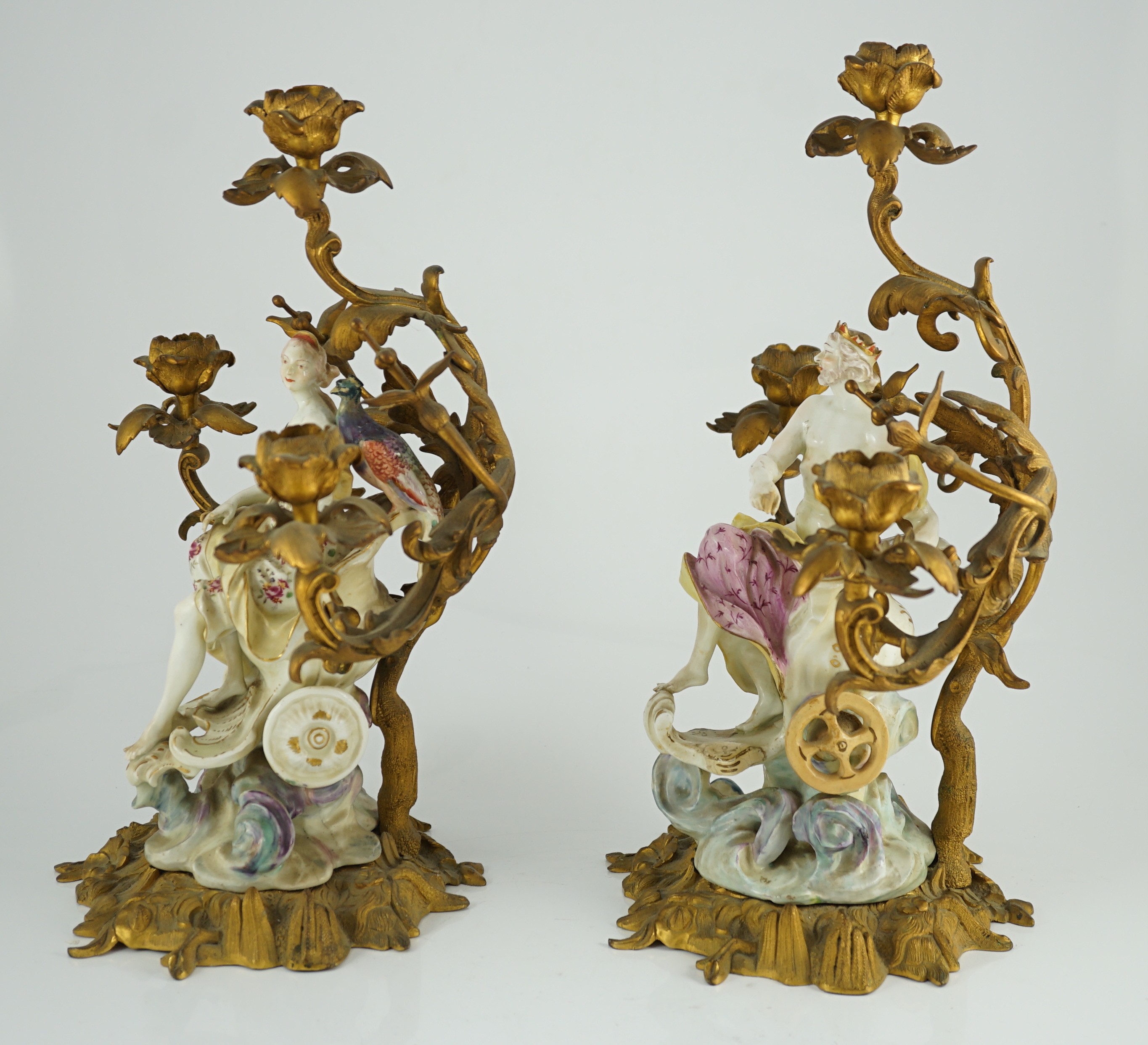 A pair of large Derby porcelain and ormolu mounted ‘Juno and Jupiter’ figural candelabra, the figures c.1760